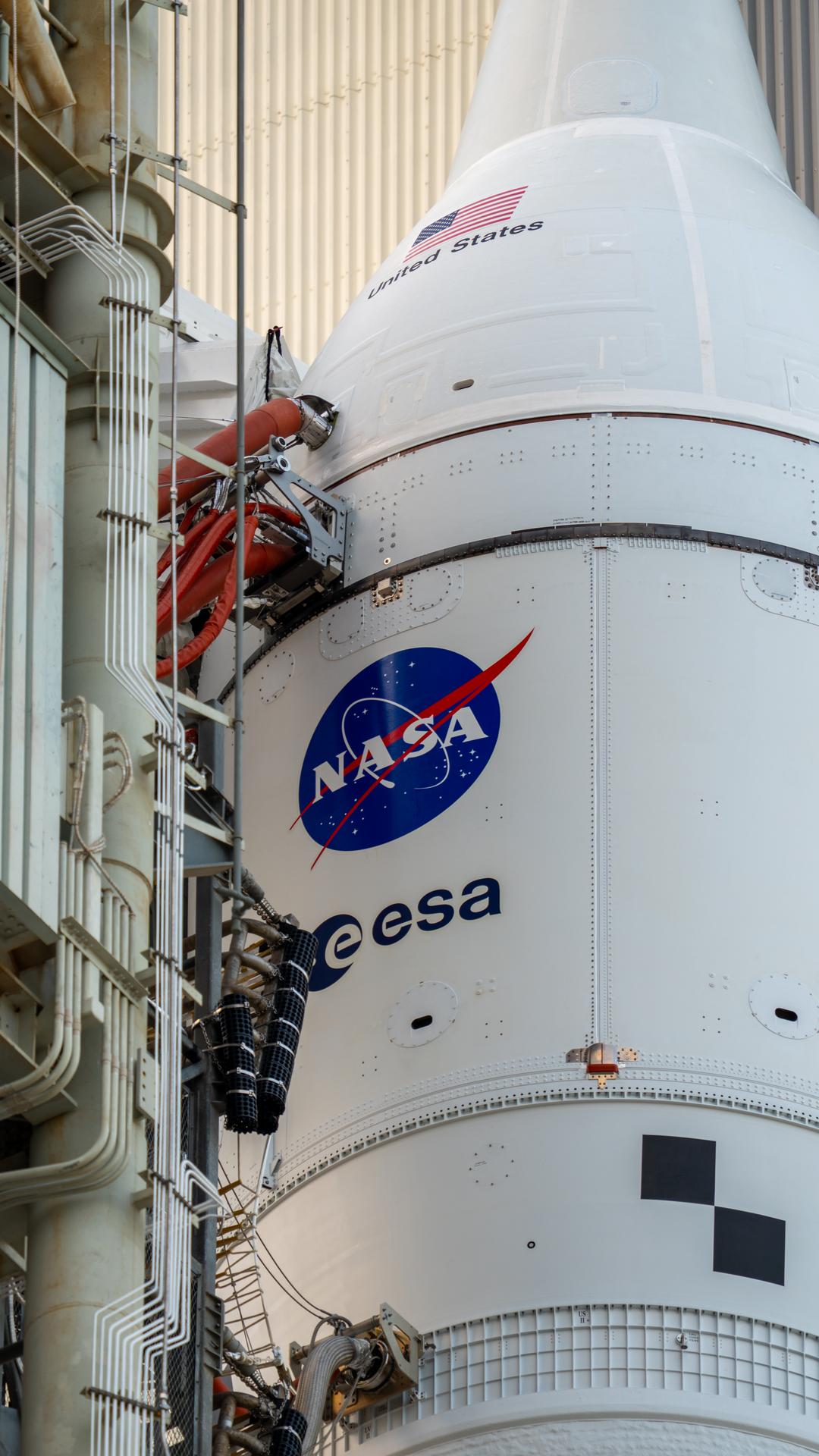 This image shows NASA’s SLS (Space Launch System) and Orion spacecraft rolling out of the Vehicle Assembly Building at NASA’s Kennedy Space Center. NASA's massive Crawler-Transporter, upgraded for the Artemis program, carries the powerful SLS rocket and Orion spacecraft on the Mobile Launcher from the Vehicle Assembly Building to Launch Pad 39B at Kennedy Space Center in preparation for the Artemis II mission. 